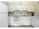 Bright kitchen with white cabinets, appliances, and countertops, offering a clean and functional space at 5905 South Kings Hwy. # 132-A, Myrtle Beach, SC 29575