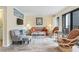 Cozy living room with ample seating, including a sofa, two chairs, and a view of the balcony at 5905 South Kings Hwy. # 132-A, Myrtle Beach, SC 29575