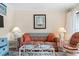 Comfortable sofa and chairs are positioned in the inviting living room at 5905 South Kings Hwy. # 132-A, Myrtle Beach, SC 29575