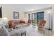 Inviting living room with comfortable seating and sliding glass doors to the balcony at 5905 South Kings Hwy. # 132-A, Myrtle Beach, SC 29575