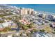 Sweeping aerial view of a coastal community with hotels, residential areas and the beautiful Atlantic ocean at 600 Hillside Dr. S, North Myrtle Beach, SC 29582
