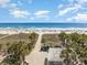 Expansive aerial view of a pristine beach and ocean, showcasing clear blue waters and sandy shores at 600 Hillside Dr. S, North Myrtle Beach, SC 29582