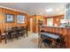 Spacious dining area with wood paneling, with seating for six, and views of the kitchen at 600 Hillside Dr. S, North Myrtle Beach, SC 29582