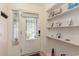 Welcoming foyer featuring a decorative glass door, neutral walls and built-in shelving at 600 Hillside Dr. S, North Myrtle Beach, SC 29582