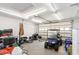 A spacious garage featuring a golf cart, storage, and ample room for vehicles at 600 Hillside Dr. S, North Myrtle Beach, SC 29582