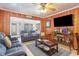Cozy living room with wood paneling, comfortable seating, and a modern entertainment setup at 600 Hillside Dr. S, North Myrtle Beach, SC 29582