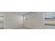 A bedroom with neutral colored carpet and light walls has two windows for natural light at 620 Culmen Ct., Myrtle Beach, SC 29588