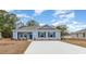 Charming single-story home with blue siding, a gray roof, and a well-maintained front yard at 620 Culmen Ct., Myrtle Beach, SC 29588