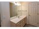 Bathroom featuring a vanity with storage, a large mirror, and a door to another room at 6207 Sweetwater Blvd. # 6207, Murrells Inlet, SC 29576