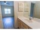 Bright bathroom features a spacious vanity and large mirror at 6207 Sweetwater Blvd. # 6207, Murrells Inlet, SC 29576