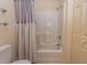 Bathroom featuring tile shower with wood-trimmed curtain at 6207 Sweetwater Blvd. # 6207, Murrells Inlet, SC 29576