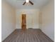 Spacious bedroom with hardwood floors, fan, and ensuite bathroom at 6207 Sweetwater Blvd. # 6207, Murrells Inlet, SC 29576