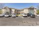 Exterior of condos with parking in front on a sunny day, great location at 6207 Sweetwater Blvd. # 6207, Murrells Inlet, SC 29576