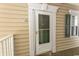 Close up of the front door of condo with sidelight and great door hardware at 6207 Sweetwater Blvd. # 6207, Murrells Inlet, SC 29576