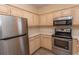Updated kitchen boasts stainless steel appliances, plenty of cabinets, and modern fixtures at 6207 Sweetwater Blvd. # 6207, Murrells Inlet, SC 29576