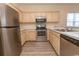 Well-equipped kitchen with stainless steel appliances, ample counter space, and wood-look floors at 6207 Sweetwater Blvd. # 6207, Murrells Inlet, SC 29576