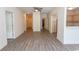 Inviting living room showcasing wood-look flooring, neutral walls, and access to other rooms at 6207 Sweetwater Blvd. # 6207, Murrells Inlet, SC 29576