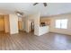 Spacious living area featuring wood-look floors, neutral paint, and an adjacent kitchen at 6207 Sweetwater Blvd. # 6207, Murrells Inlet, SC 29576
