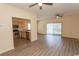 Open-concept living space with kitchen, ceiling fans, and sliding doors to exterior at 6207 Sweetwater Blvd. # 6207, Murrells Inlet, SC 29576