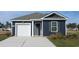 Charming single-story home with navy siding, white trim, and a convenient attached garage at 623 Culmen Ct., Myrtle Beach, SC 29588