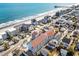 Aerial view of an oceanside community featuring an assortment of condos and housing near the beach at 625 N Waccamaw Dr. # 301, Murrells Inlet, SC 29576