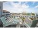Charming balcony with seating overlooking a neighborhood and distant skyline view at 625 N Waccamaw Dr. # 301, Murrells Inlet, SC 29576