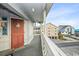 Condo balcony with views of neighboring buildings and distant glimpses of the ocean at 625 N Waccamaw Dr. # 301, Murrells Inlet, SC 29576
