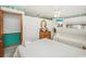 Bedroom featuring two beds, a ceiling fan, nautical decor, and TV at 625 N Waccamaw Dr. # 301, Murrells Inlet, SC 29576