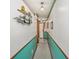 Hallway with a glimpse of the front door, decorated with nautical-themed artwork at 625 N Waccamaw Dr. # 301, Murrells Inlet, SC 29576