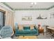 Relaxing living room featuring comfortable seating, a ceiling fan, and beachy decor at 625 N Waccamaw Dr. # 301, Murrells Inlet, SC 29576