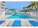 Community swimming pool and lounge area surrounded by well-maintained landscaping at 625 N Waccamaw Dr. # 301, Murrells Inlet, SC 29576