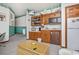Snack bar area featuring wooden cabinets, a microwave, and a mini-fridge at 625 N Waccamaw Dr. # 301, Murrells Inlet, SC 29576