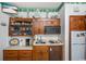 Snack bar with wooden cabinets, microwave, mini-fridge, and a small sink at 625 N Waccamaw Dr. # 301, Murrells Inlet, SC 29576