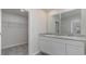 Modern bathroom featuring dual sinks, white cabinets, and gray countertop at 632 Culmen Ct., Myrtle Beach, SC 29588
