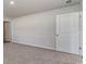Neutral bedroom with carpet flooring, two white doors, and white trim at 632 Culmen Ct., Myrtle Beach, SC 29588