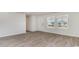 Bright living room with neutral walls, wood-look floors, and a large window at 632 Culmen Ct., Myrtle Beach, SC 29588