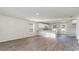 Open-concept living area with wood-look floors and a bright kitchen at 632 Culmen Ct., Myrtle Beach, SC 29588