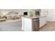 Open-concept living area with granite countertops, stainless appliances, and an adjacent living area at 643 Culmen Ct., Myrtle Beach, SC 29588