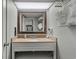 Well-lit bathroom featuring a granite countertop vanity with a decorative mirror at 6804 N Ocean Blvd. # 1127, Myrtle Beach, SC 29572