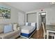 Charming bedroom featuring a cozy couch and a comfortable bed with fresh linens at 6804 N Ocean Blvd. # 1127, Myrtle Beach, SC 29572