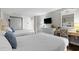 Spacious bedroom with two beds, a writing desk, and a comfortable chair at 6804 N Ocean Blvd. # 1127, Myrtle Beach, SC 29572
