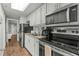 Efficient kitchen with black appliances and sleek white cabinets for a clean look at 6804 N Ocean Blvd. # 1127, Myrtle Beach, SC 29572