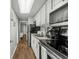 Efficient kitchen with black appliances and sleek white cabinets for a clean look at 6804 N Ocean Blvd. # 1127, Myrtle Beach, SC 29572