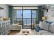 Comfortable living room opening to a balcony with stunning ocean views at 6804 N Ocean Blvd. # 1127, Myrtle Beach, SC 29572
