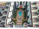 Aerial view of a beautiful outdoor pool and lounging area surrounded by lush greenery and architectural charm at 6804 N Ocean Blvd. # 1127, Myrtle Beach, SC 29572