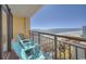 Balcony with ocean views and comfortable seating provides a tranquil outdoor living space at 6900 N Ocean Blvd. # 1505, Myrtle Beach, SC 29572