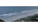An overhead shot of a beach showing people and ocean waves in Myrtle Beach at 6900 N Ocean Blvd. # 1505, Myrtle Beach, SC 29572