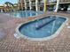 Shallow hot tub with decorative tile feature and pool nearby at 6900 N Ocean Blvd. # 1505, Myrtle Beach, SC 29572