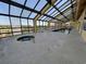 Indoor pool and hot tub area with tables and seating at 6900 N Ocean Blvd. # 1505, Myrtle Beach, SC 29572