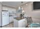 Functional kitchenette with mini-fridge, microwave, and breakfast bar, perfect for quick meals at 6900 N Ocean Blvd. # 1505, Myrtle Beach, SC 29572